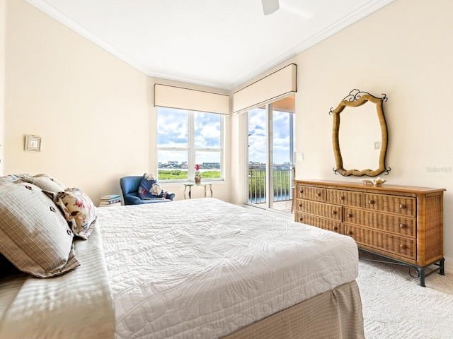 carpeted bedroom with ceiling fan, access to exterior, and crown molding