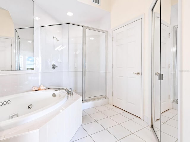 bathroom with shower with separate bathtub and tile patterned floors