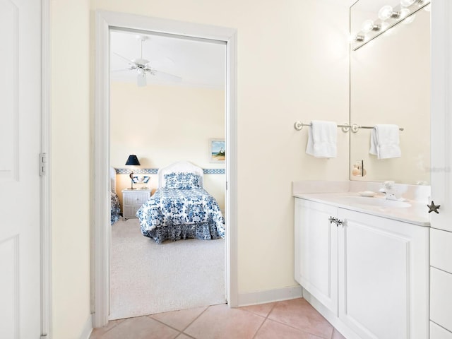 bathroom with tile patterned floors, ceiling fan, and vanity