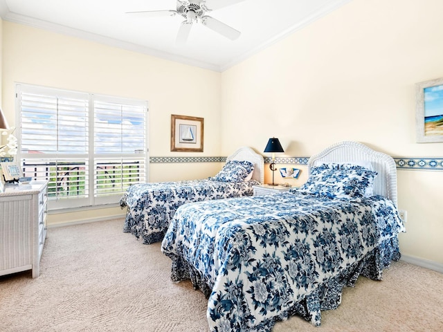 bedroom featuring carpet flooring, ceiling fan, and ornamental molding