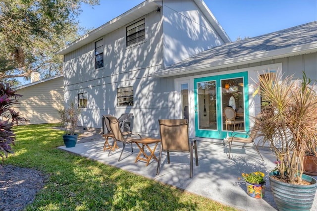 back of house featuring a yard and a patio area