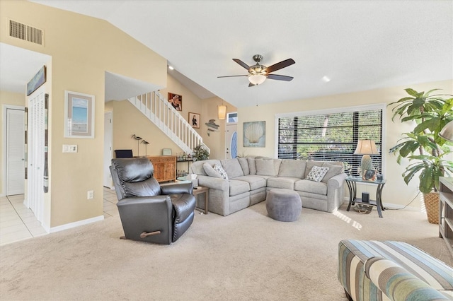 carpeted living room featuring vaulted ceiling and ceiling fan