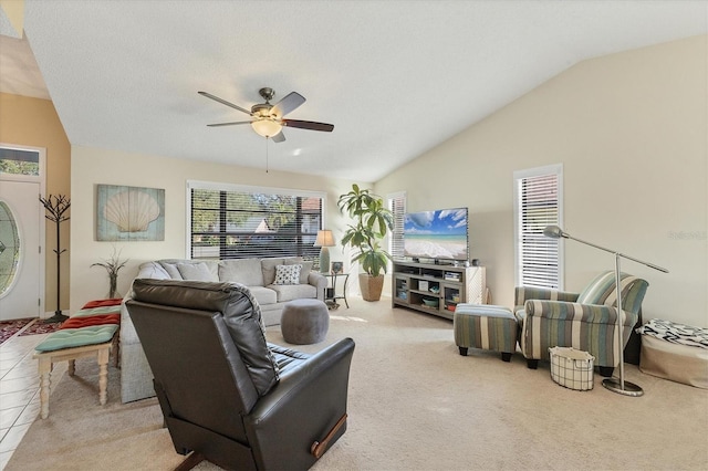 living room with ceiling fan and lofted ceiling