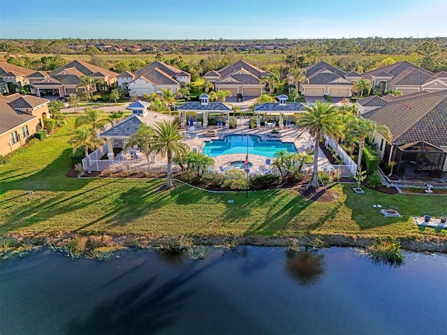 birds eye view of property with a water view