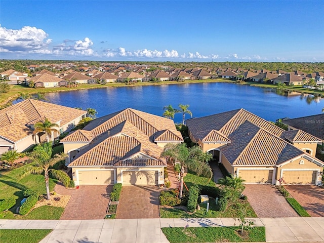 bird's eye view with a residential view and a water view