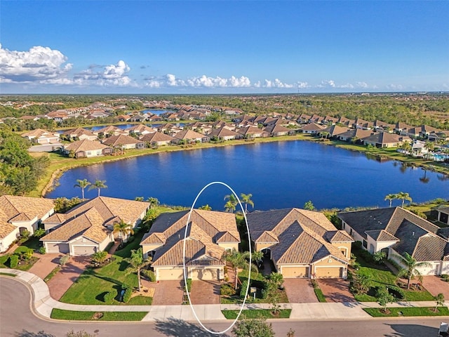 aerial view with a water view and a residential view