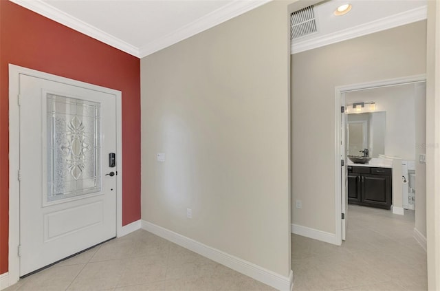 foyer featuring baseboards, light tile patterned flooring, visible vents, and crown molding