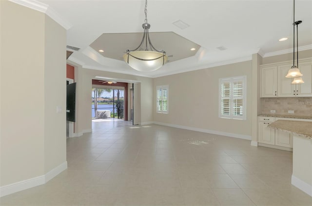 interior space featuring crown molding, recessed lighting, a raised ceiling, light tile patterned flooring, and baseboards