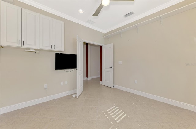 interior space with baseboards, visible vents, ceiling fan, ornamental molding, and light tile patterned flooring