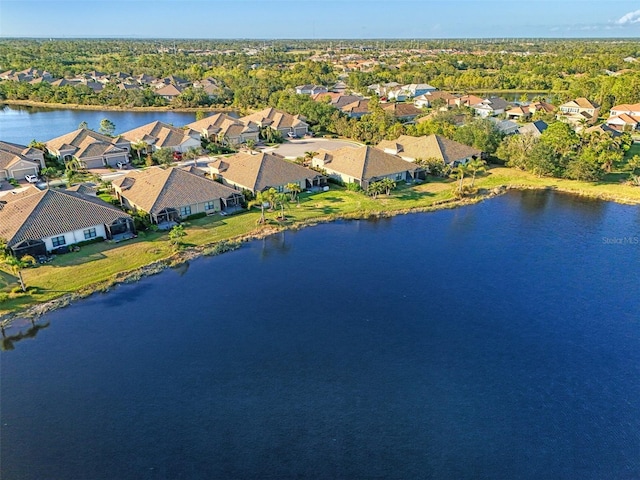 birds eye view of property featuring a residential view and a water view