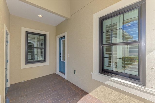 exterior space featuring a patio area and stucco siding