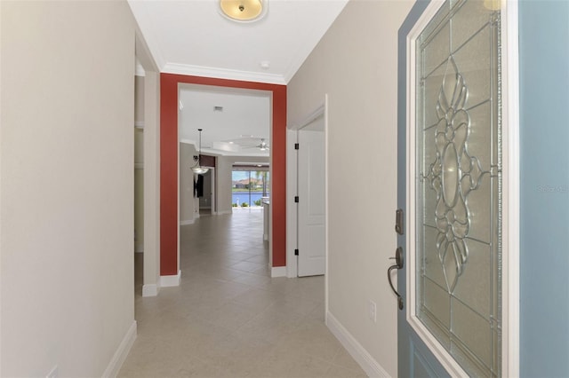 hallway featuring baseboards and ornamental molding