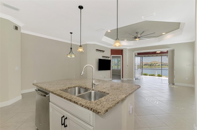 kitchen featuring a kitchen island with sink, a sink, white cabinets, open floor plan, and dishwasher