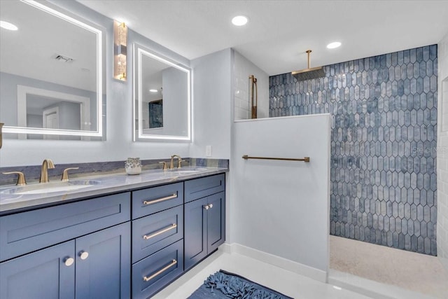 bathroom with a shower and vanity