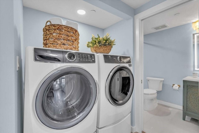 washroom featuring separate washer and dryer