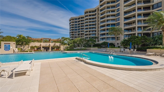 view of swimming pool featuring a patio area