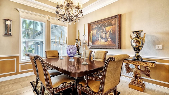 dining area featuring an inviting chandelier, a wealth of natural light, and ornamental molding