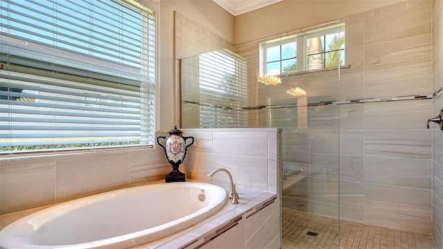 bathroom featuring separate shower and tub and crown molding