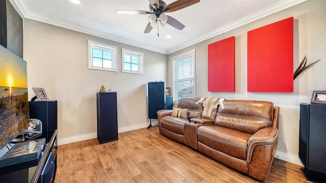 living room featuring a textured ceiling, ceiling fan, crown molding, and light hardwood / wood-style flooring