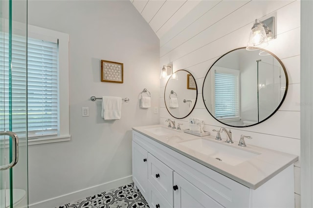 bathroom with tile patterned flooring, vanity, wood walls, and vaulted ceiling