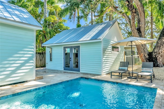 back of property with a patio area and an outdoor structure