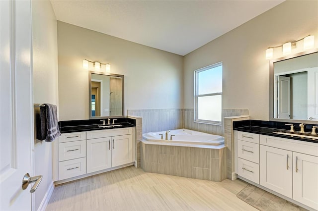 bathroom with plus walk in shower and vanity