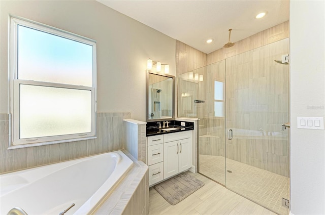 bathroom featuring vanity, tile patterned floors, and independent shower and bath