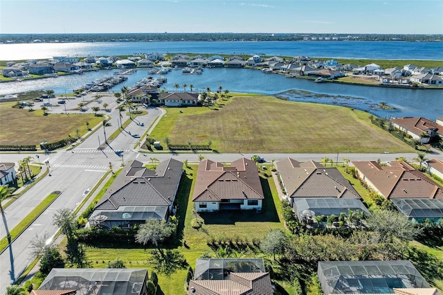 birds eye view of property featuring a water view