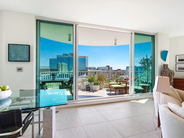 entryway featuring floor to ceiling windows and light tile patterned flooring