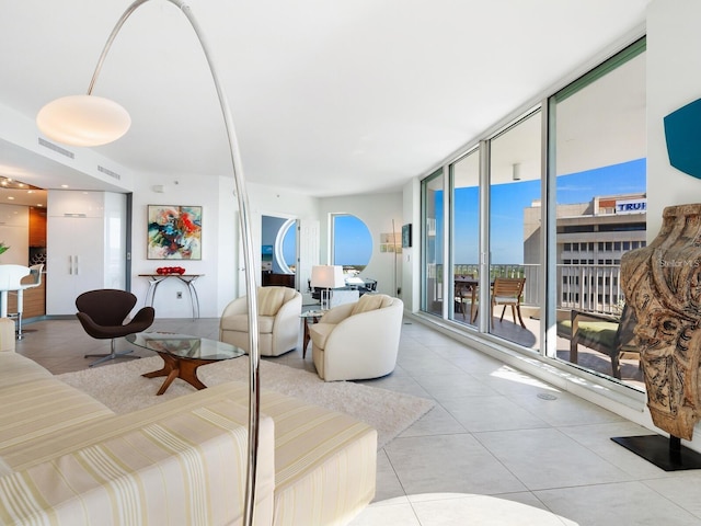 living room with floor to ceiling windows