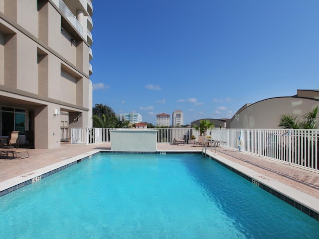 view of swimming pool with a patio