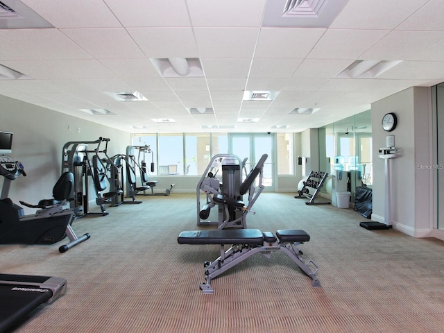 exercise room with light colored carpet