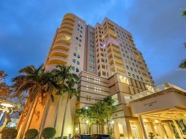 view of outdoor building at dusk