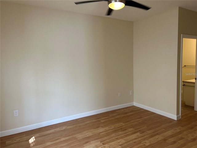 unfurnished room with ceiling fan and light wood-type flooring