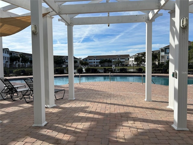 view of swimming pool with a pergola and a patio area