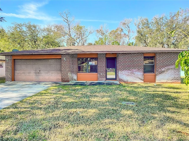 ranch-style house with a garage and a front lawn