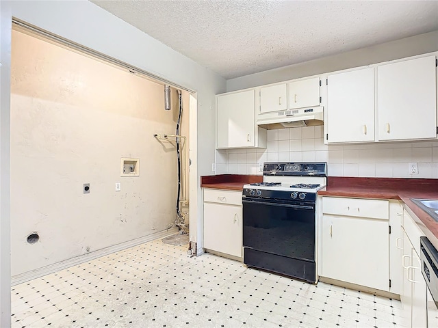 kitchen featuring tasteful backsplash, black range oven, a textured ceiling, dishwasher, and white cabinetry