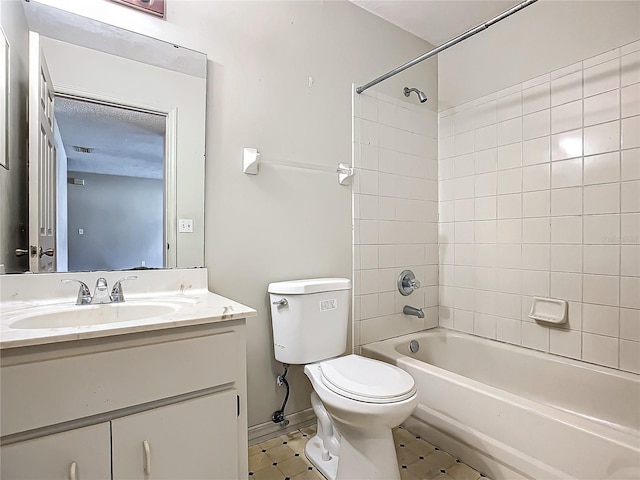 full bathroom with vanity, toilet, and tiled shower / bath