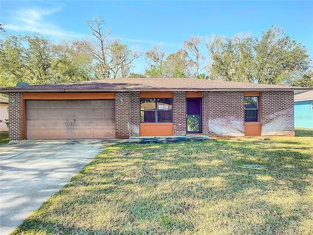 ranch-style house with a garage and a front lawn