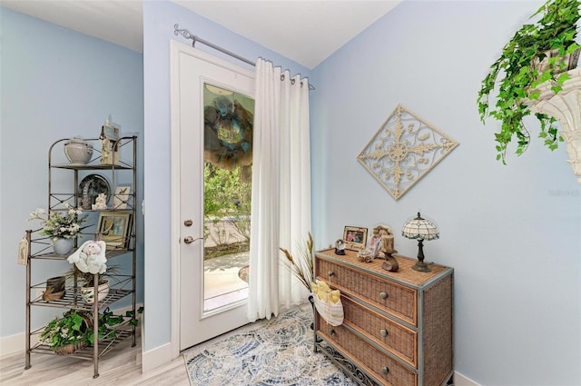 doorway with light hardwood / wood-style floors