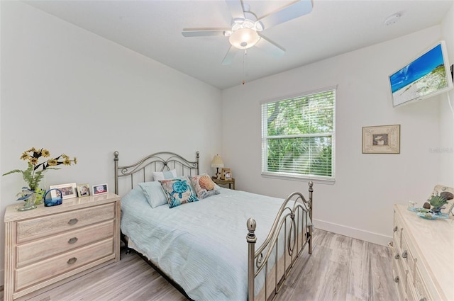 bedroom with ceiling fan and light wood-type flooring