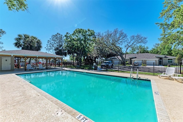 view of swimming pool with a patio area