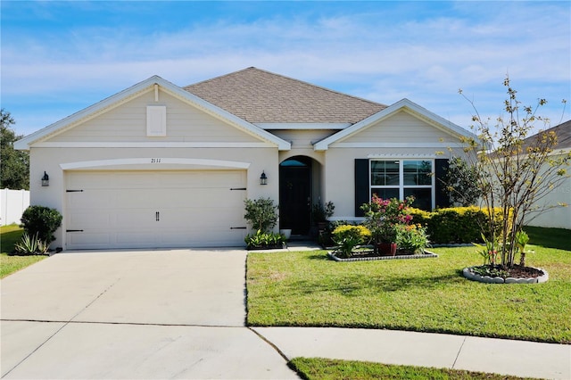 ranch-style house featuring a front yard and a garage