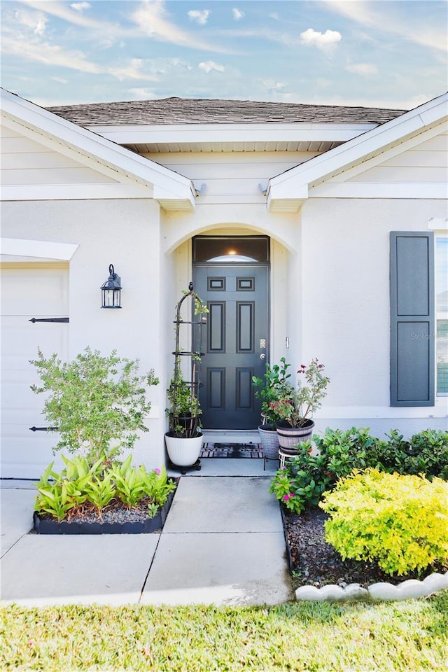 property entrance with a garage