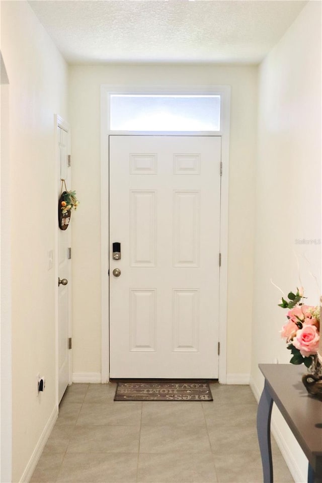 entrance foyer featuring a textured ceiling