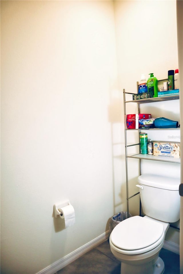 bathroom featuring tile patterned floors and toilet