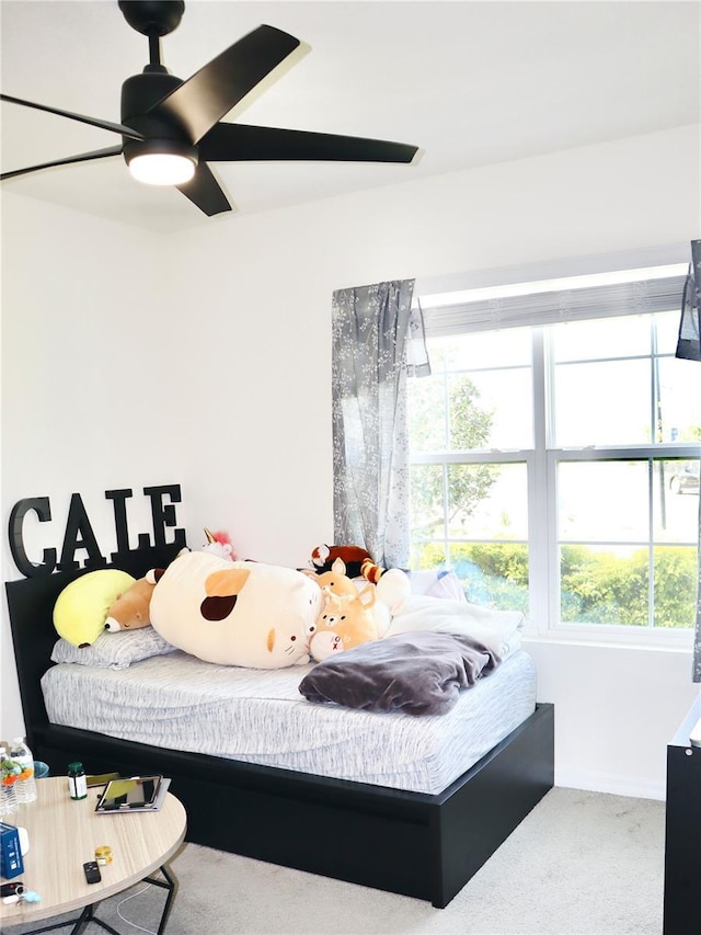 carpeted bedroom featuring ceiling fan