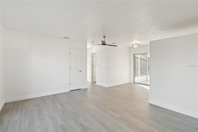 empty room with light wood-type flooring and ceiling fan