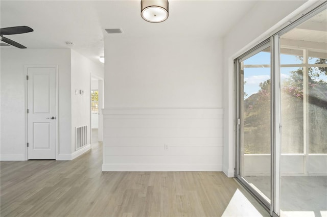 spare room featuring ceiling fan and light hardwood / wood-style floors