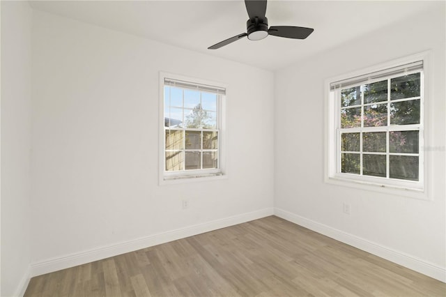 empty room featuring ceiling fan and light wood-type flooring